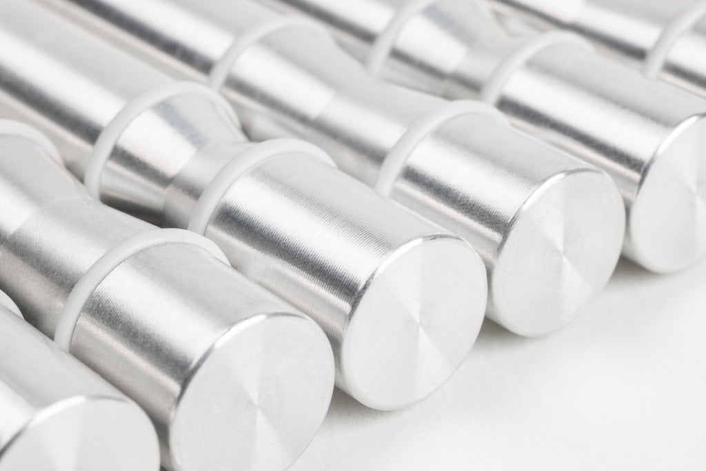 Angled close-up of Winepegs Nek Rite 1 Lite wall-mounted wine pegs in brushed aluminum finish
