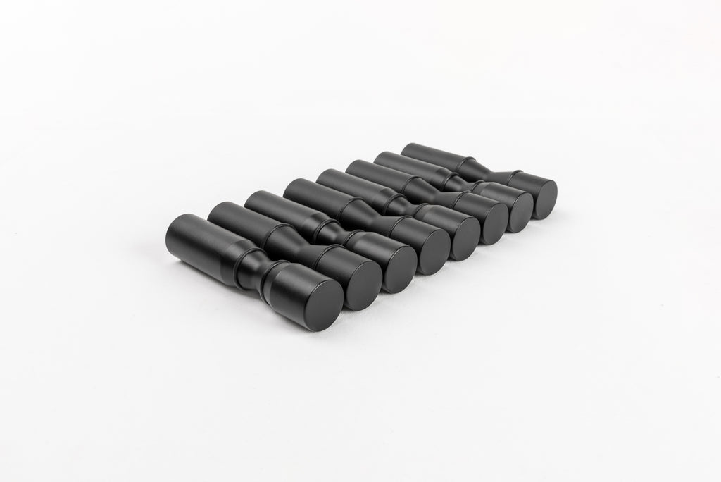 Group of Winepegs Nek Rite 1 Lite wall-mounted black wine pegs in a row, showcasing minimalist design and smooth finish