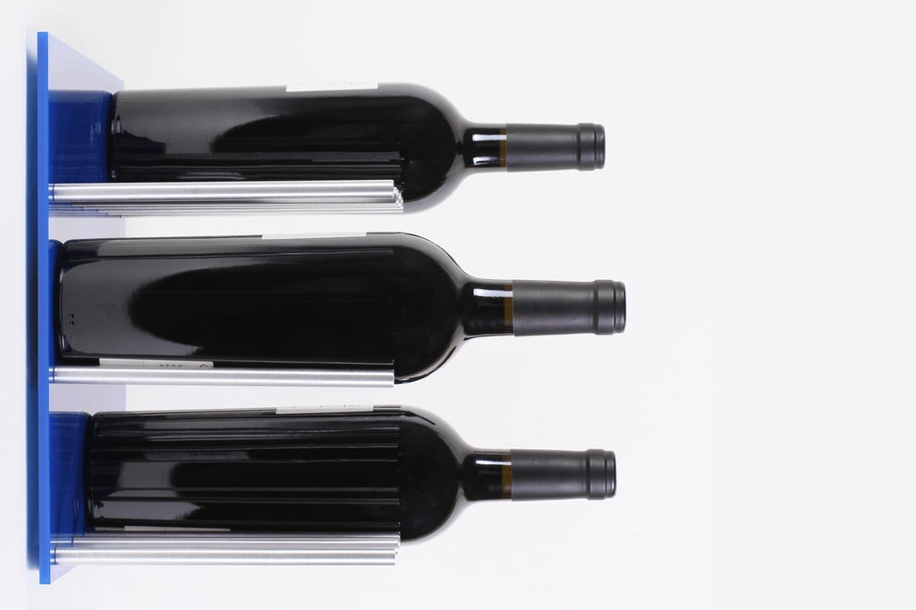Wine Pegs XY 3x3. Side view of wine bottle wall mounted on wall